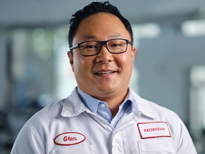 Honda maintenence employee smiling in uniform